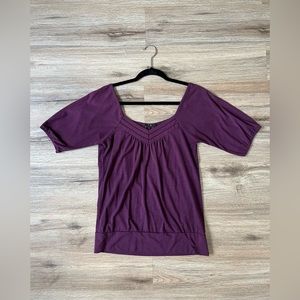 Size is Medium. Purple Square shoulder V neckline blouse.